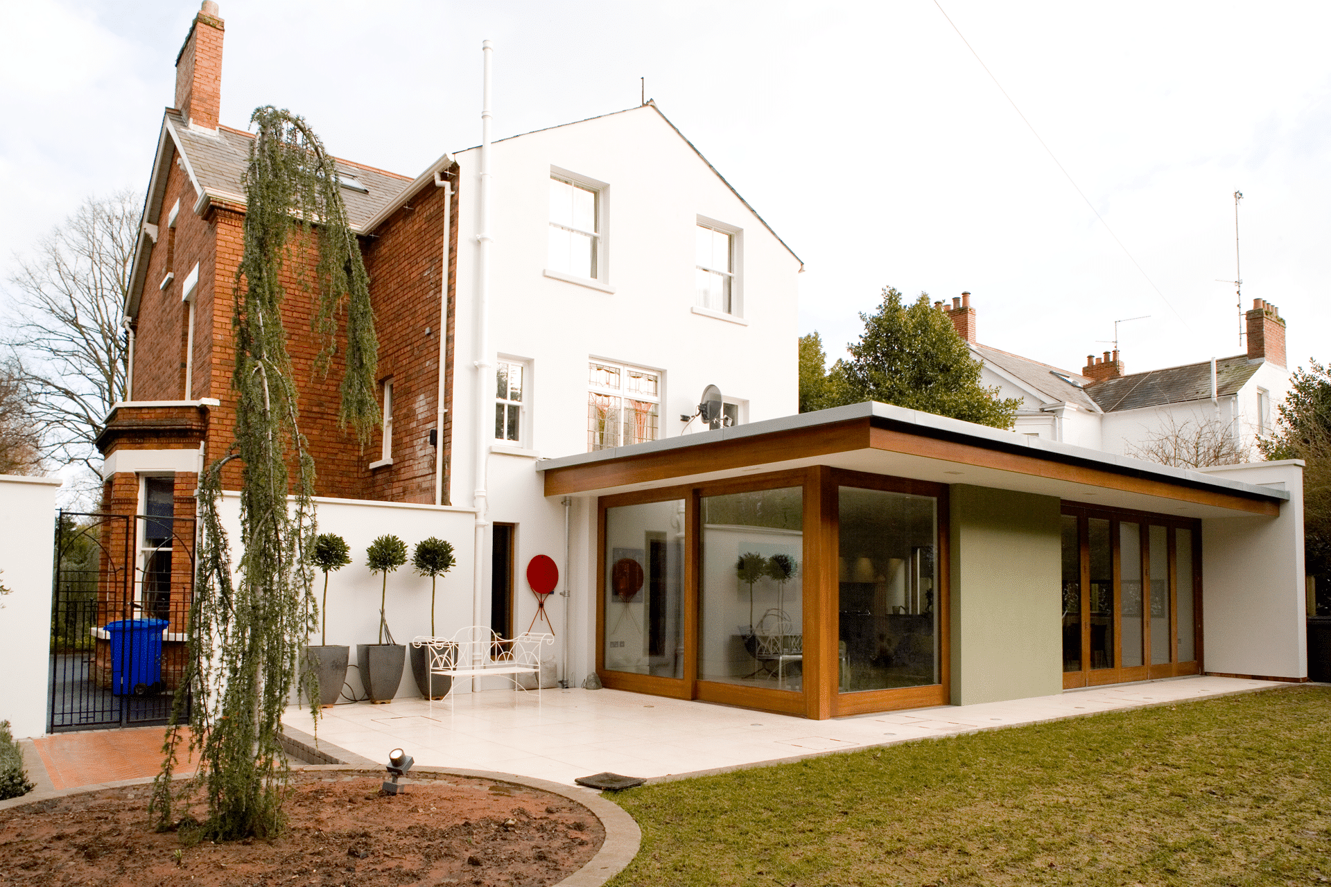 View from interior of new house designed by McCann Moore Architects in Hillsborough, Northern Ireland. The interior view to the courtyard garden is through a fully glazed wall