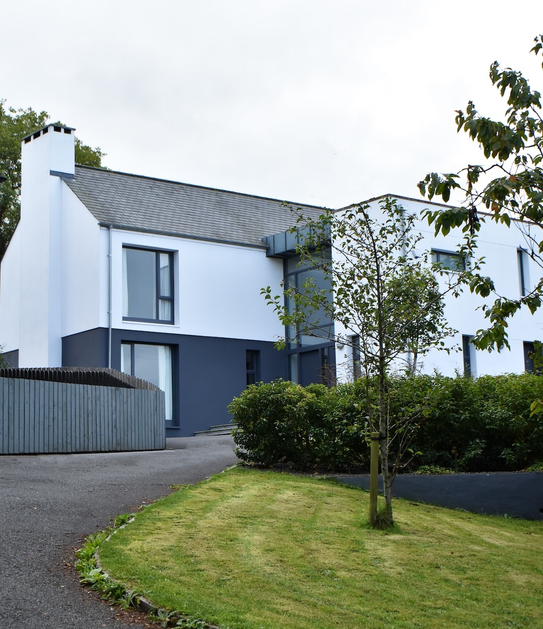 Contemporary new build hilltop house in Hillsborough, as seen from below on driveway