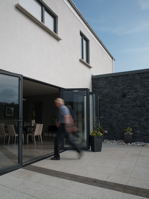 External bi-fold doors between kitchen and courtyard