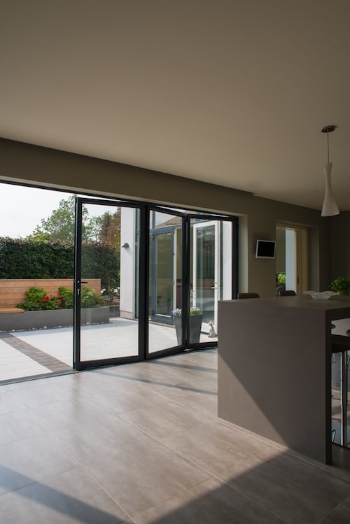 Bi-fold doors from kitchen to courtyard garden