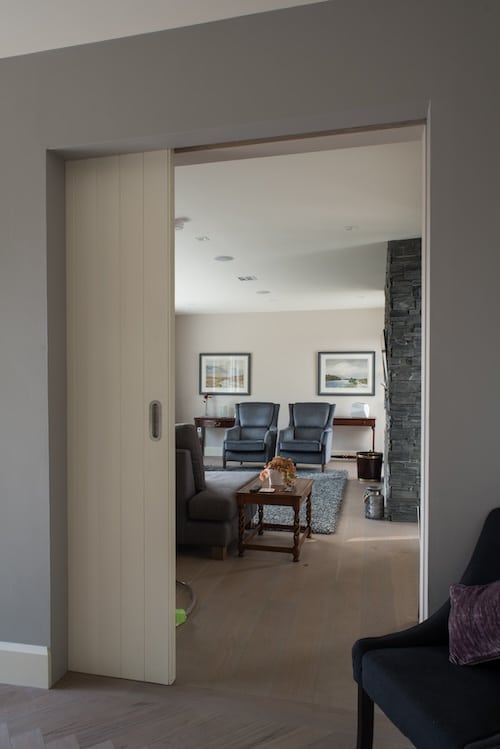 Open pocket door from hallway to living area